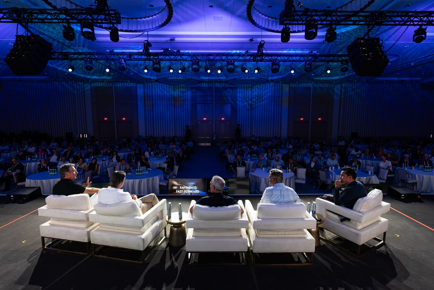 Live event audience watching a speaker on stage